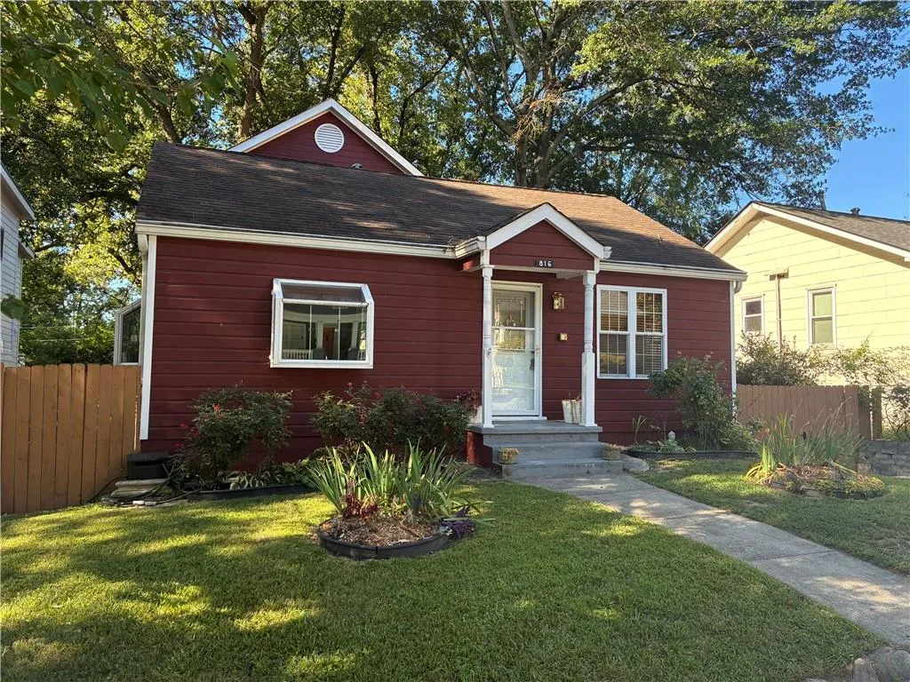 View of front facade featuring roof with shingles
