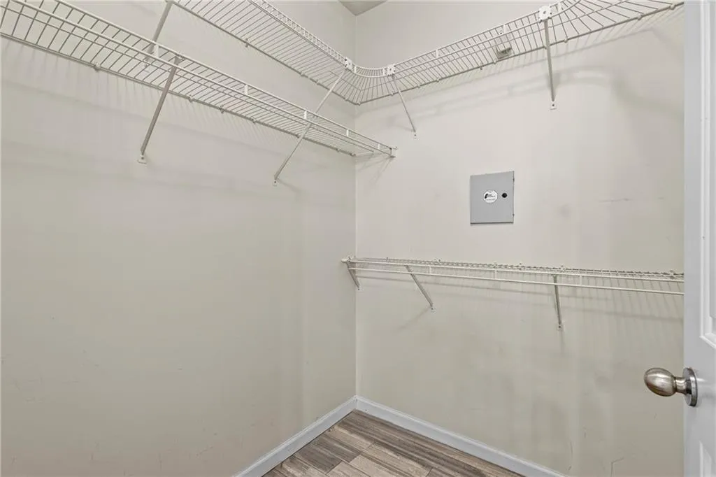 Walk in closet featuring light wood finished floors