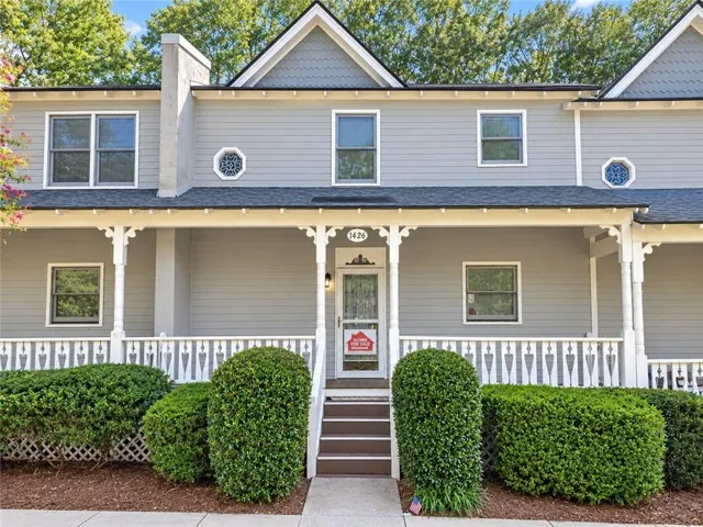 Gray siding exterior with white trim