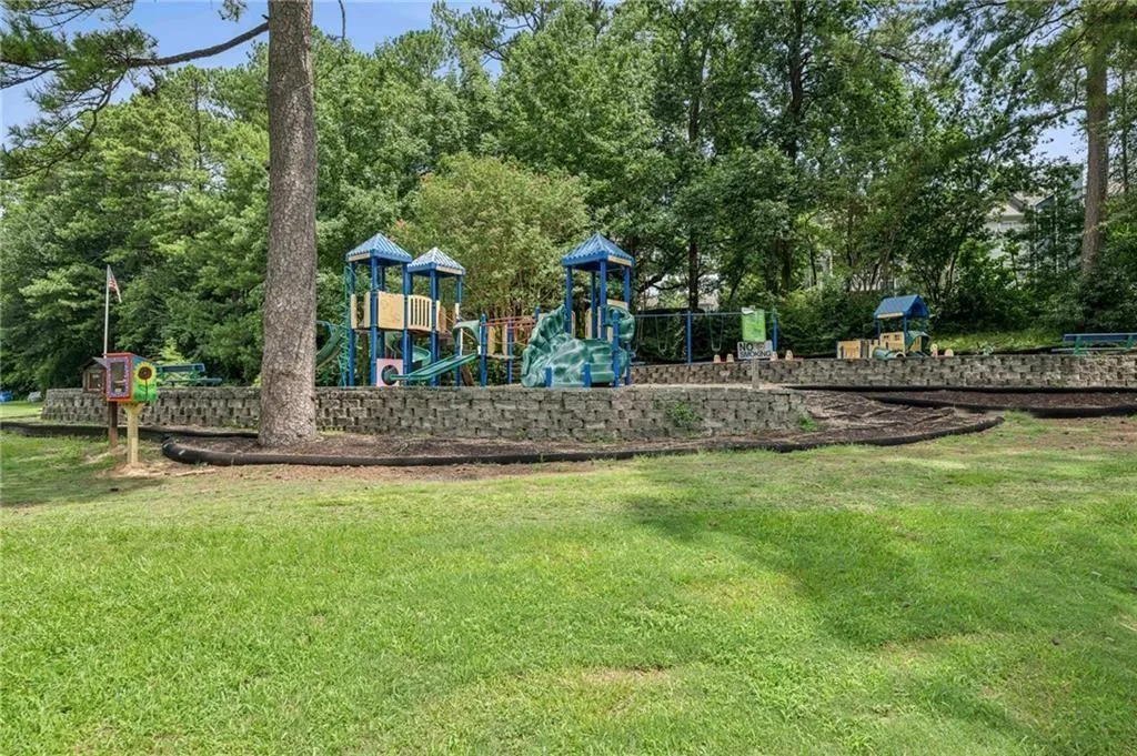 View of jungle gym featuring a yard