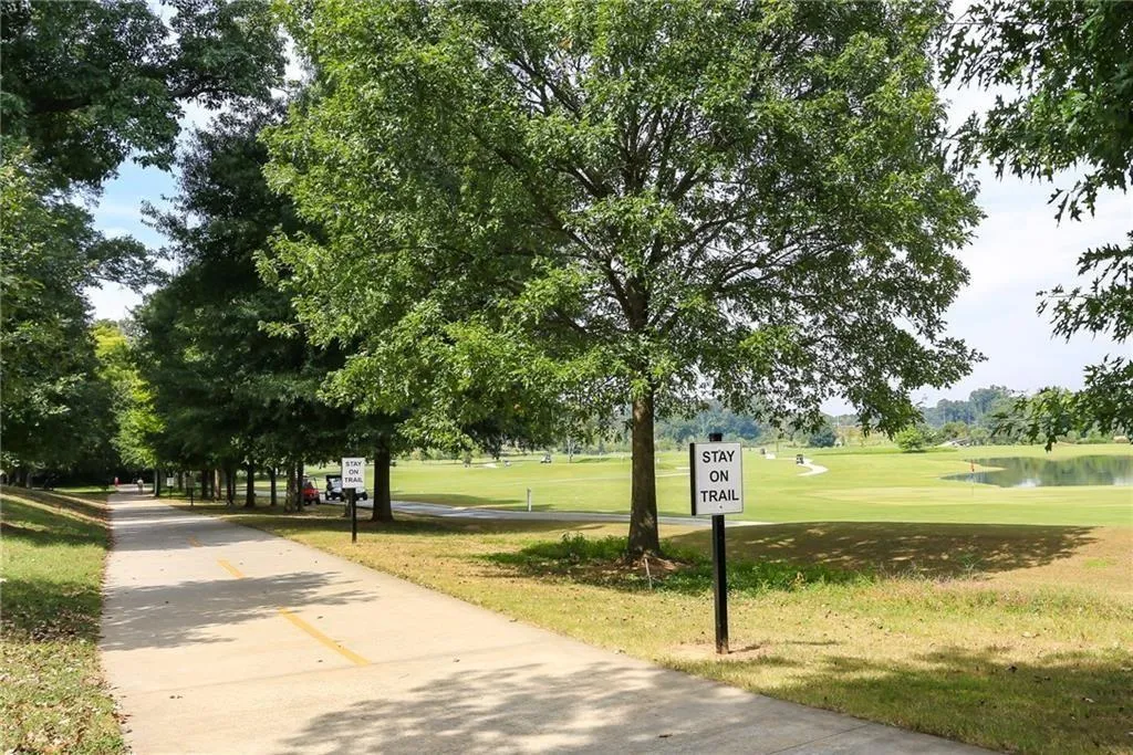 View of property's community featuring a yard