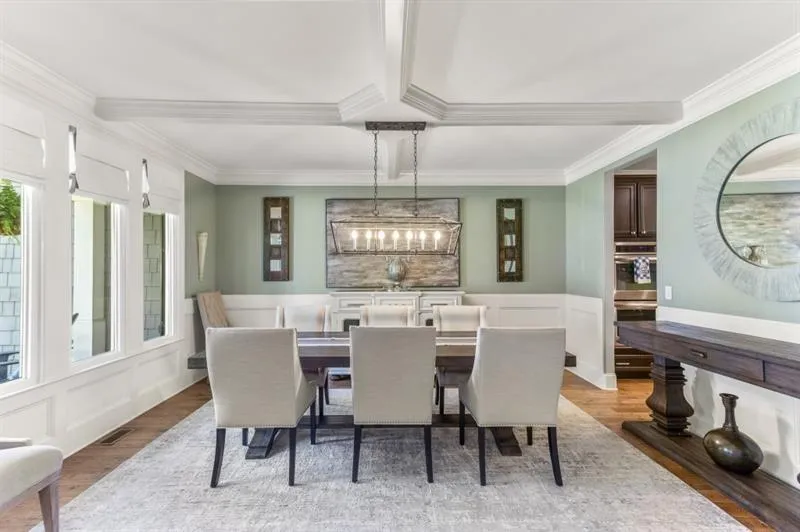 Dining space featuring crown molding and wood-type flooring