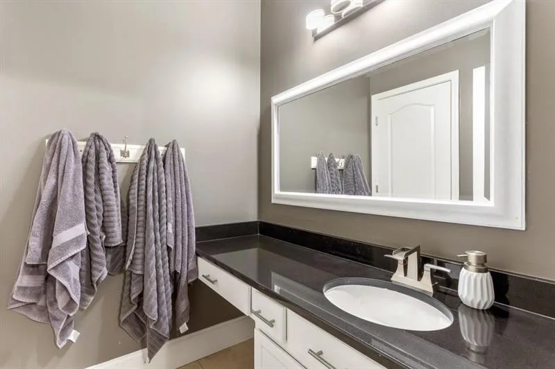 Bathroom featuring tile patterned floors and vanity