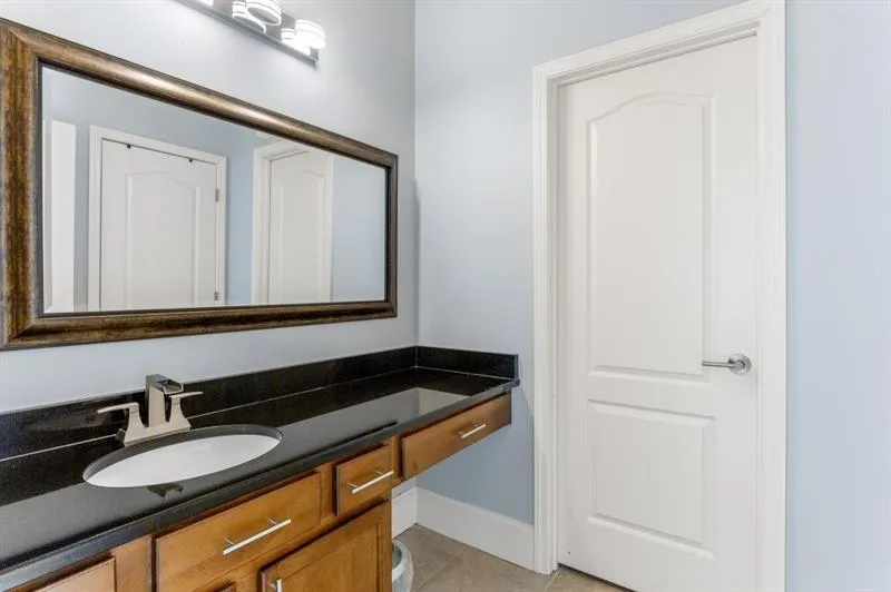 Bathroom with vanity and tile patterned floors