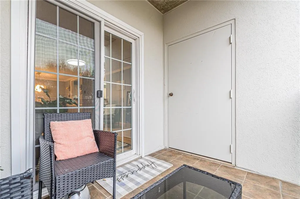 Property entrance with stucco siding
