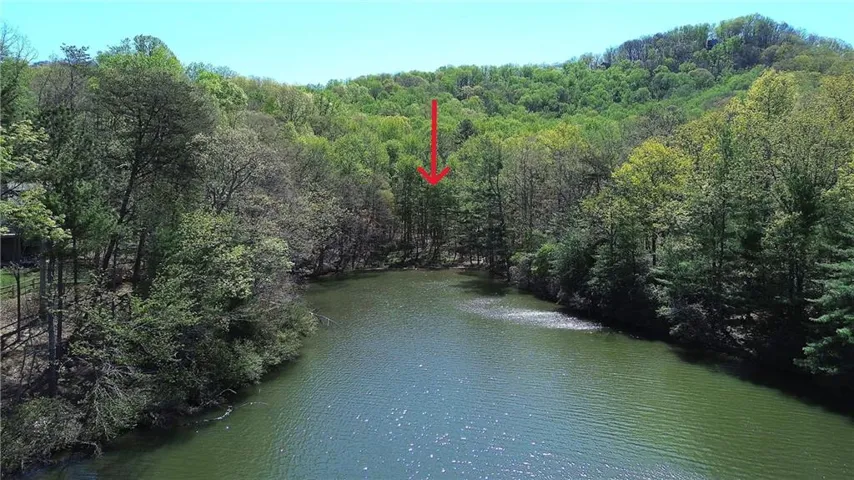 Lot 2340 in Bent Tree has 96 Feet of Lake Frontage. The lot slopes gently down from the street.