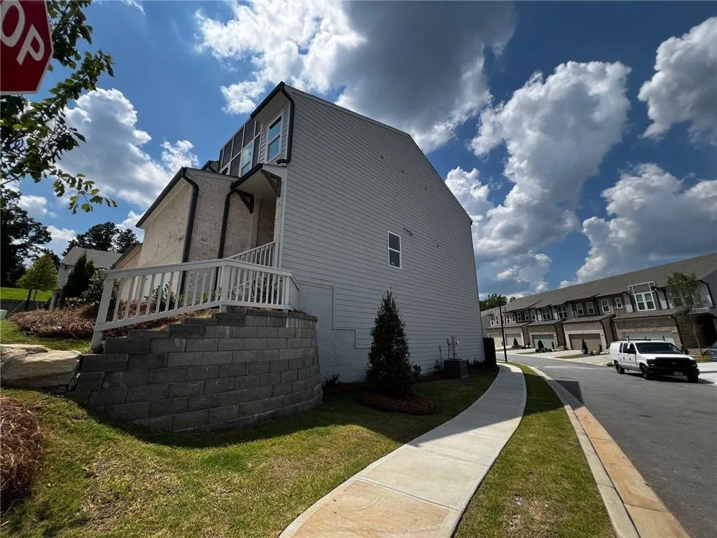 This stunning Corban is a highly desirable end unit in a building of only two homesites!