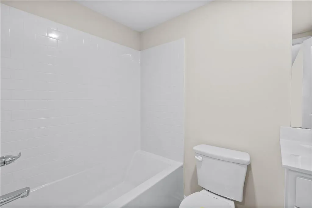 Bathroom with shower / washtub combination and vanity