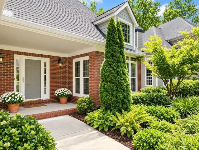 Enjoy the front gardens from your pretty front porch area.