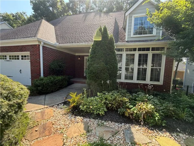 Enjoy the front gardens from your pretty front porch area.