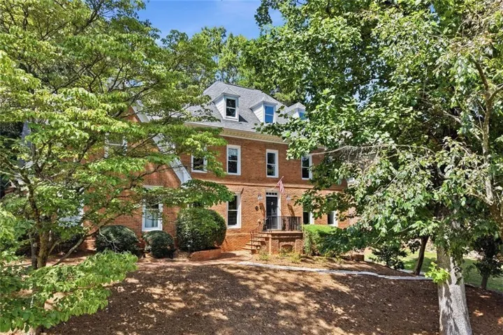The setting is beautiful and private, huge front lawn on a corner lot.
