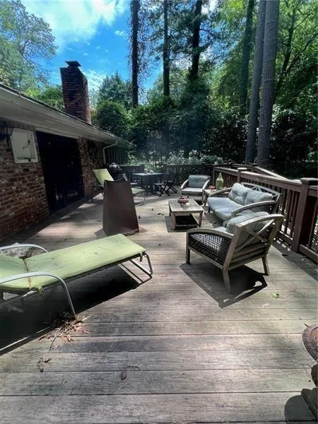 Wooden deck featuring an outdoor living space