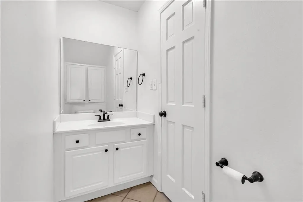 Bathroom with vanity and light tile patterned floors