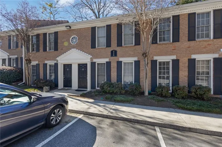 View of front of home featuring brick siding