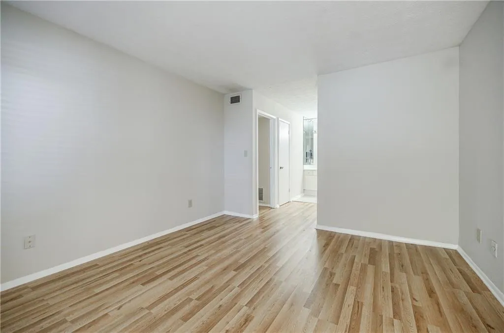 Bedroom featuring light wood-style flooring and baseboards