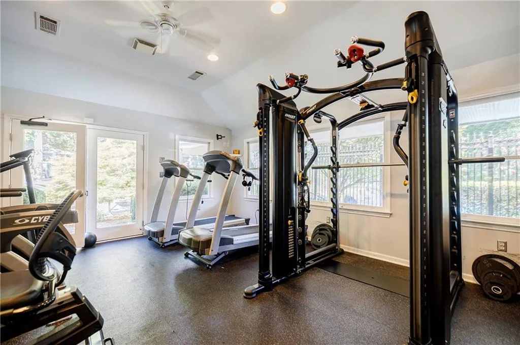 Exercise room with recessed lighting, and a ceiling fan