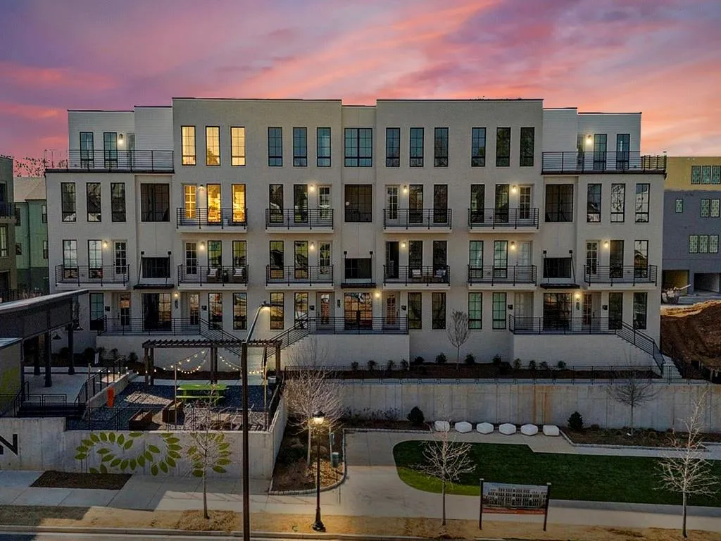 View of property at dusk