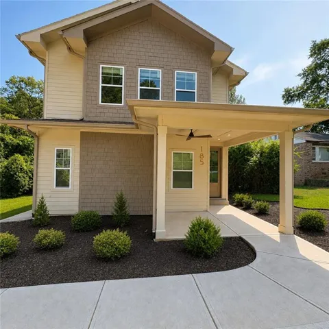 Contemporary exterior with multi-toned siding and shake accents