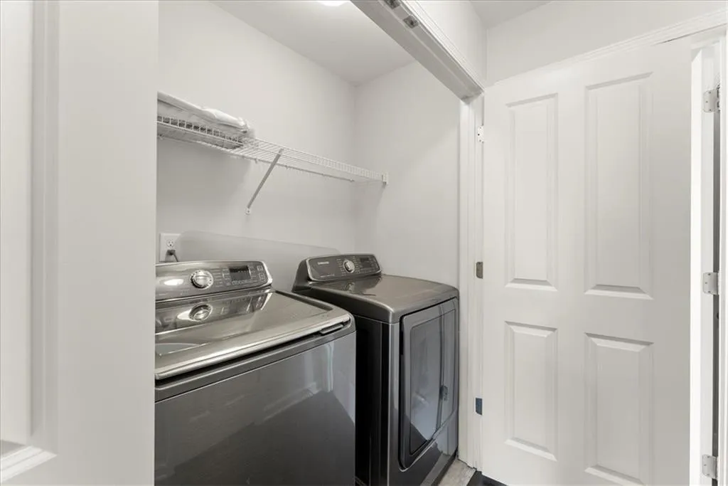 Washroom featuring washer and dryer