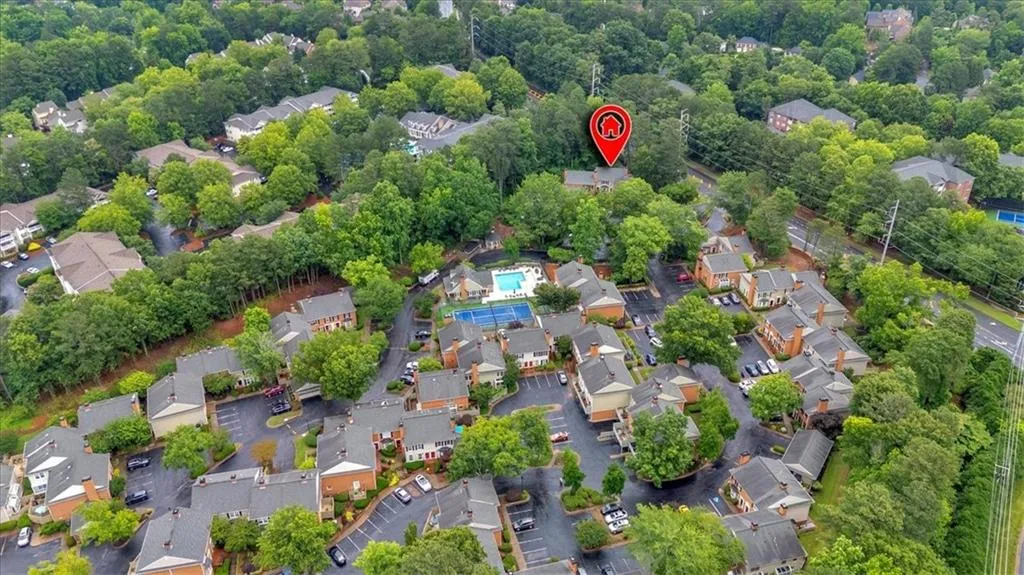Aerial overview of property's location featuring nearby suburban area