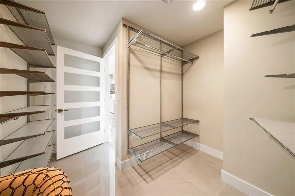 Spacious Walk-In with Custom Storage System