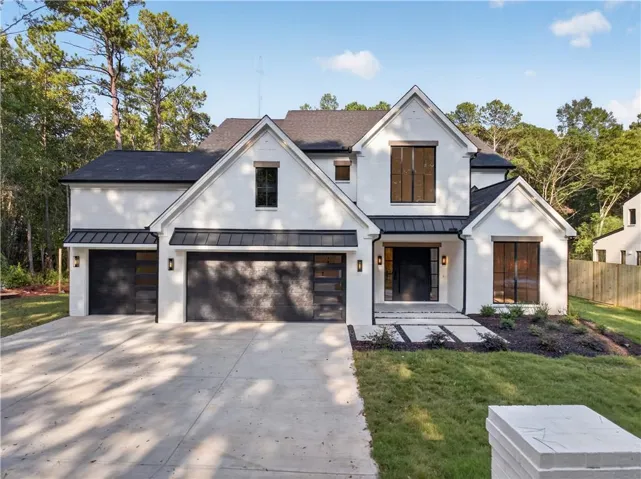 White brick exterior with dark trim accents