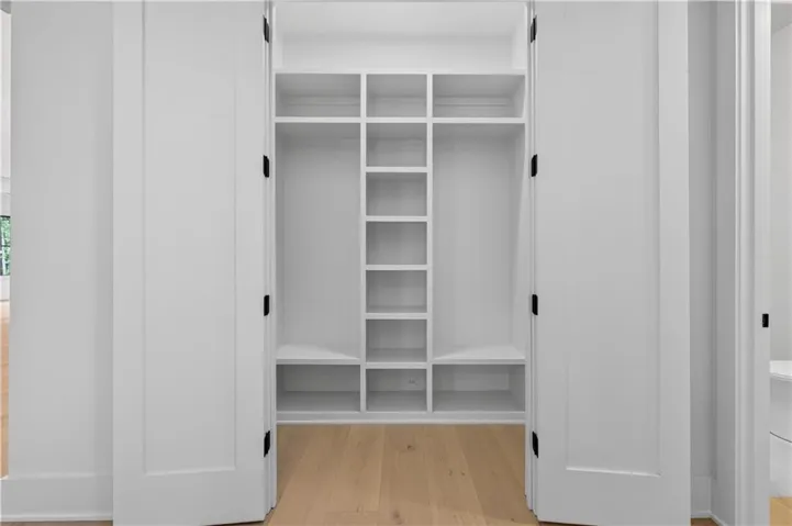 Built-in custom shelving system with multiple compartments
