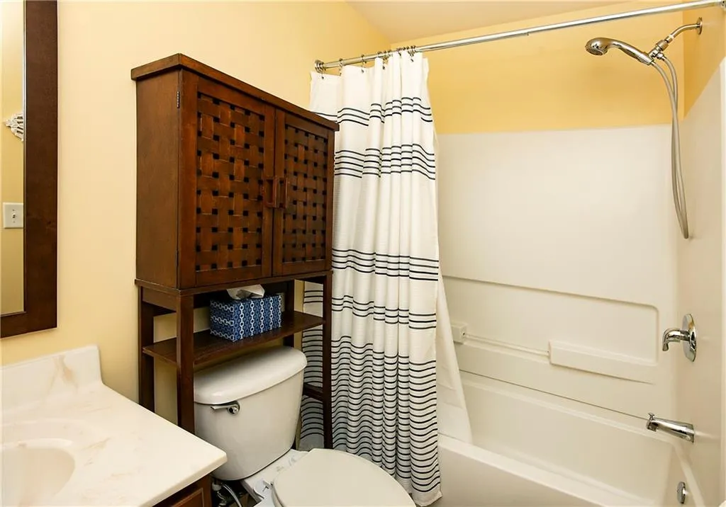Bathroom with vanity and shower / bath combo