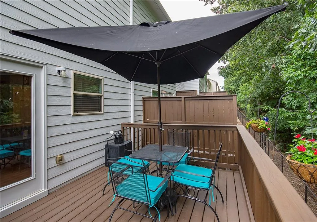 Wooden terrace featuring outdoor dining area