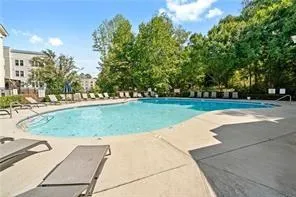 Community pool with a patio area