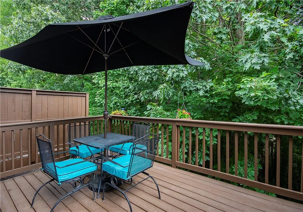 Wooden terrace featuring outdoor dining space