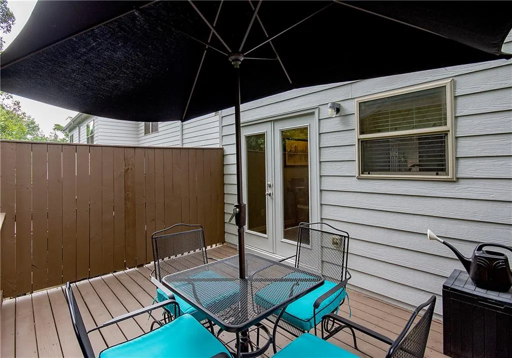 Deck with french doors and outdoor dining area
