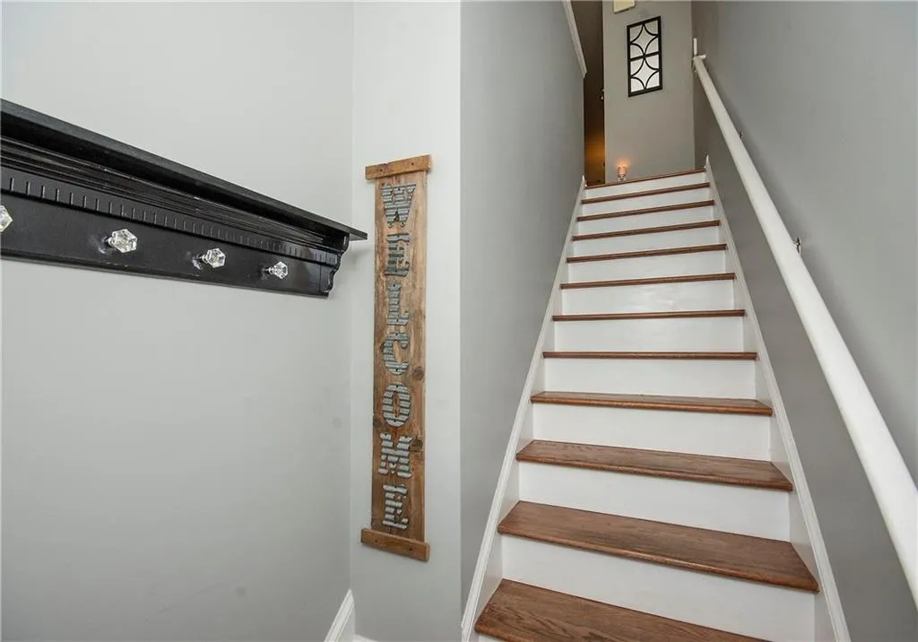 Stairway featuring baseboards