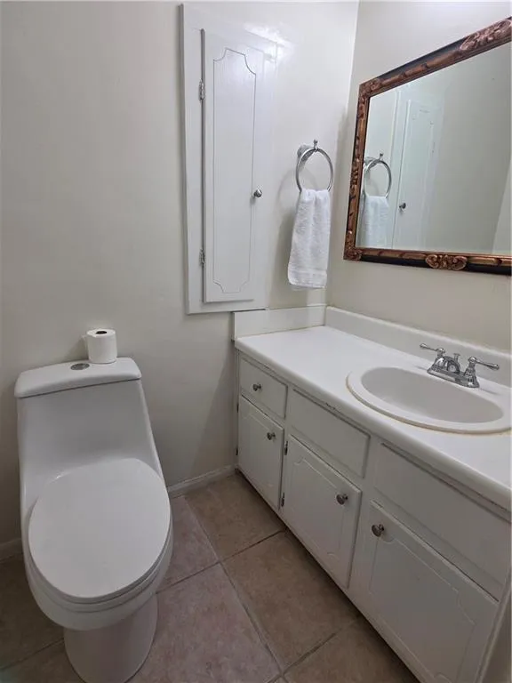 Bathroom with vanity and tile patterned flooring
