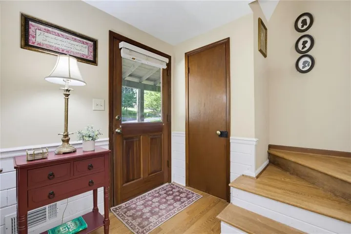Stairway is tucked away at entry