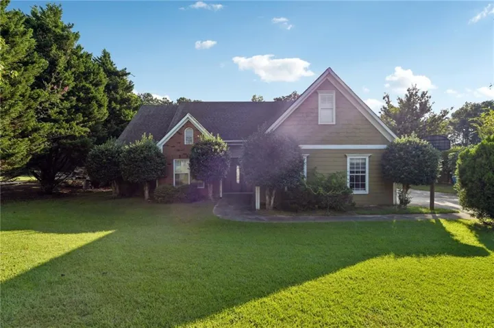 Brick and siding exterior with a gabled roofline
