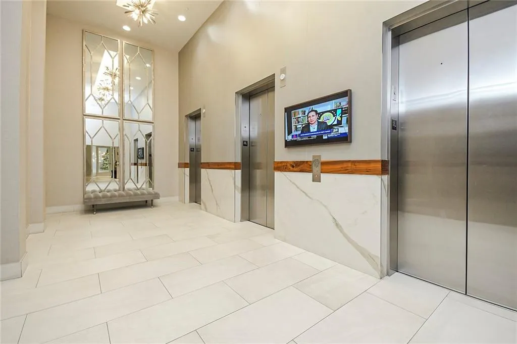 Lobby with a towering ceiling and recessed lighting