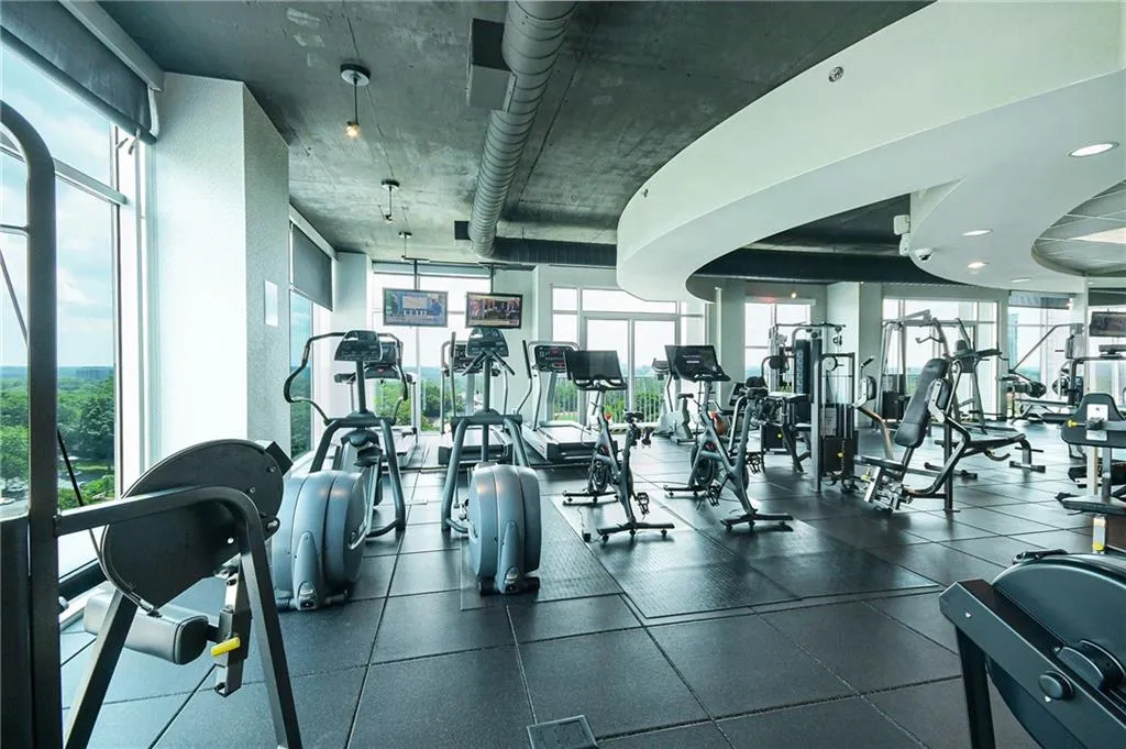 Exercise room featuring healthy amount of natural light