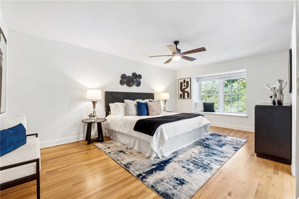 Bedroom featuring light wood-style floors and a ceiling fan