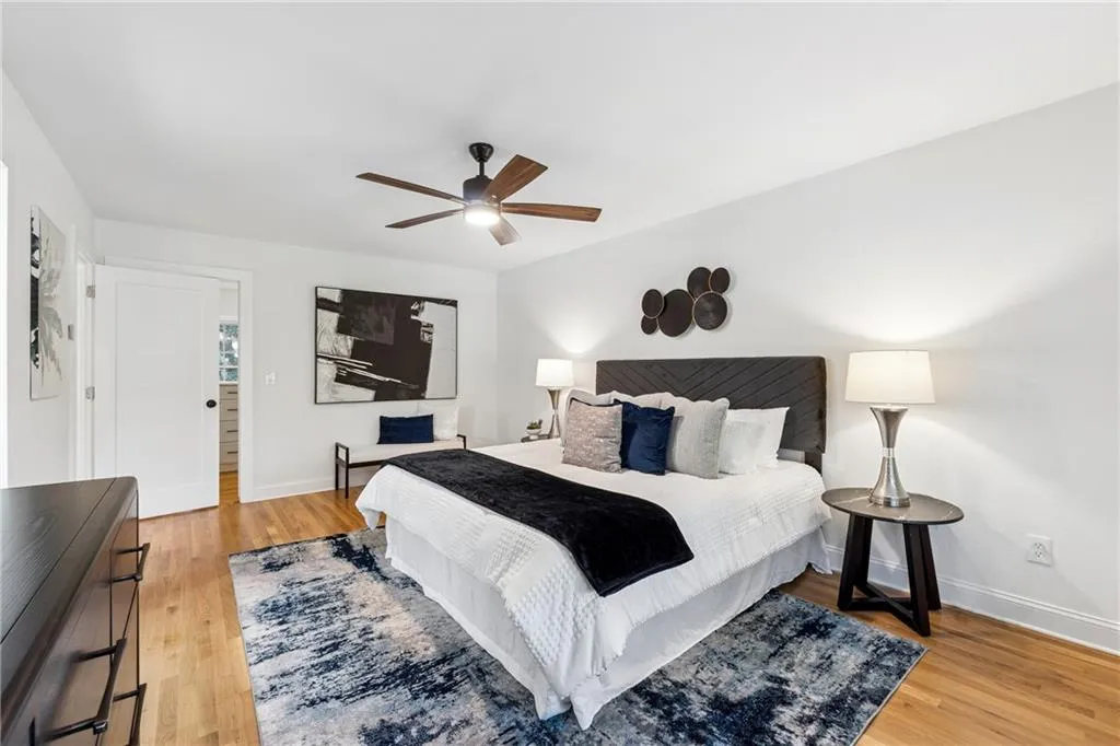 Bedroom featuring light wood-style flooring and ceiling fan