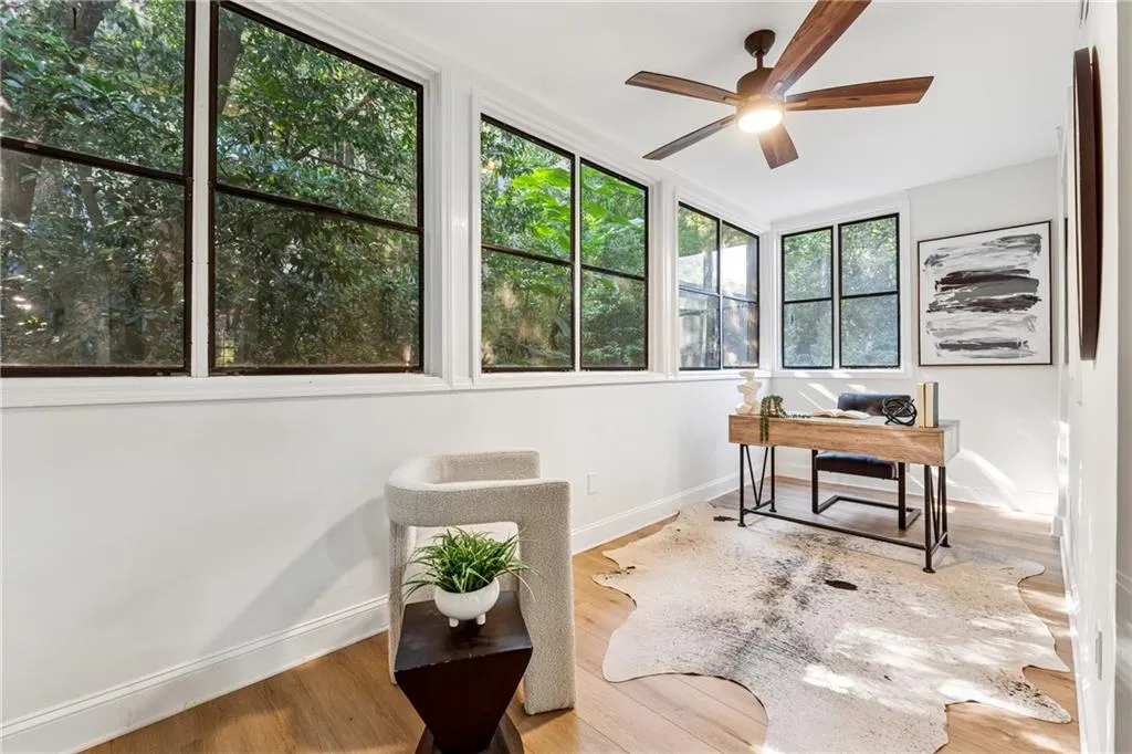 Office featuring wood finished floors and ceiling fan