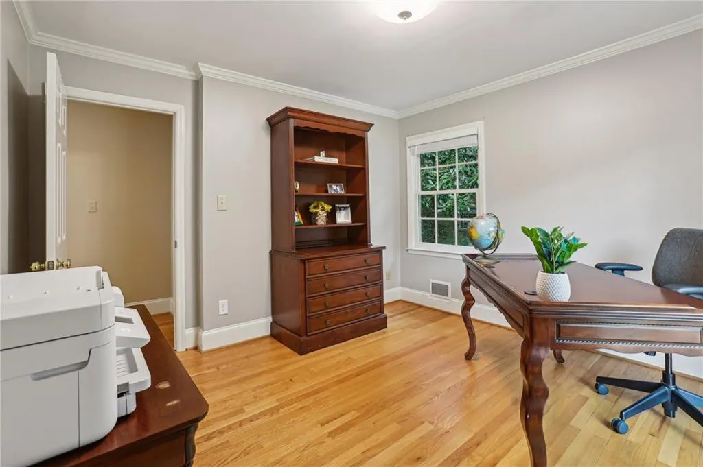 Corner bedroom currently used as a home office.