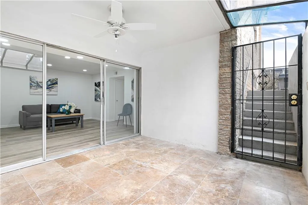 View of patio featuring ceiling fan