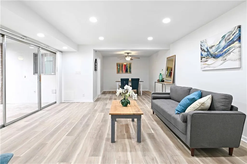 Living area featuring recessed lighting, a ceiling fan, and light wood-type flooring