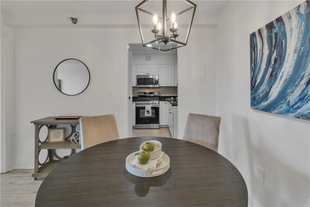 Dining room featuring a chandelier and light wood-type flooring