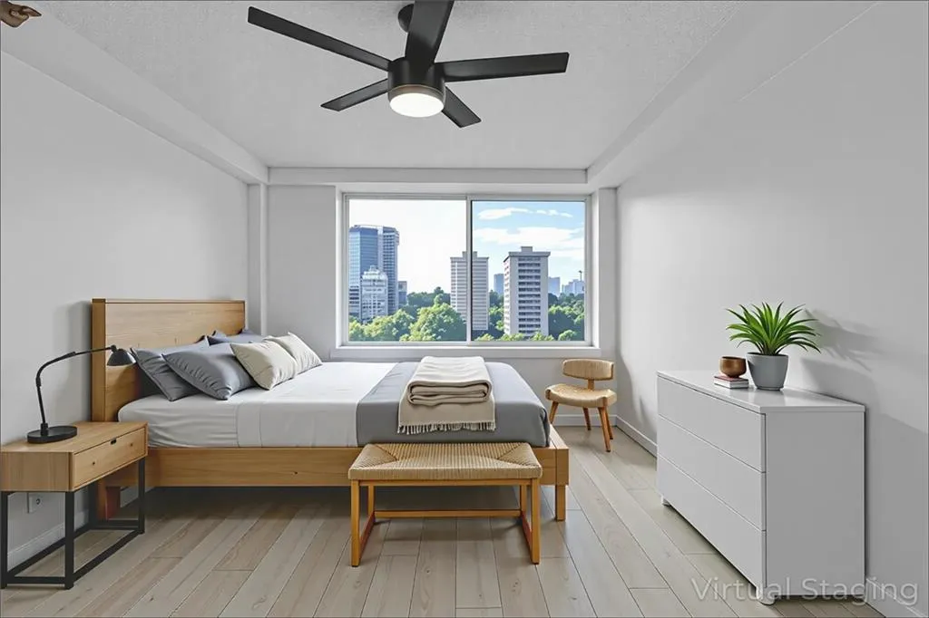 Bedroom featuring a view of skyline, light wood finished floors, a textured ceiling, and ceiling fan