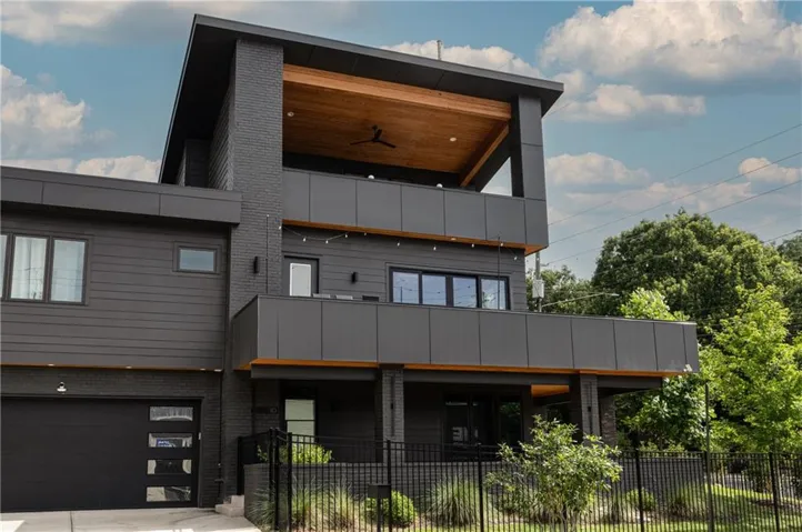 Contemporary multi-level residence featuring 3 outdoor living areas, recessed lighting, and a two-car garage