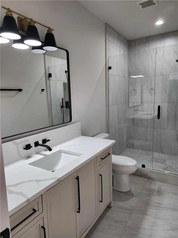 Bathroom 7 Full bath with vanity, a stall shower, and recessed lighting