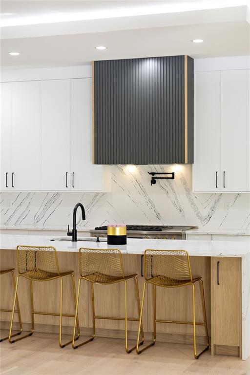 The chef’s kitchen is a culinary delight, equipped with top-of-the-line stainless steel appliances, custom cabinets, quartz countertops, a spacious island, a meticulously designed walk-in pantry, and an open dining room perfect for entertaining.