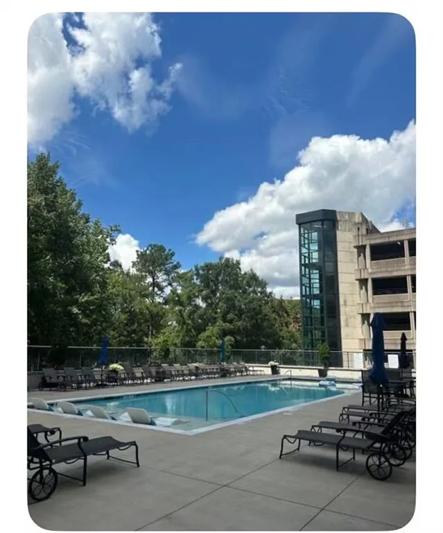 Community pool with a patio area